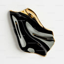 Abstract Black and Gold Sculpture with Fluid Design