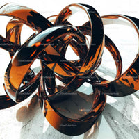 Intricate Abstract Metal Sculpture with Interlocking Loops
