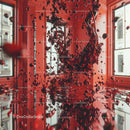 Dynamic Red Liquid Splash in Modern Interior Setting