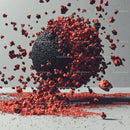 Dynamic Explosion of Red Fragments Around Black Sphere