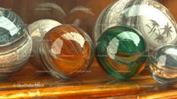 Colorful Glass Spheres on Wooden Surface