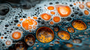 Vibrant Orange and Black Bubbles on Liquid Surface