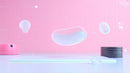 Floating Glossy Shapes on Pink Abstract Background