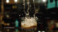 Dynamic Splash of Ice in Glass at Bar