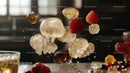 Vibrant Raspberries and Gelatin Candies in Mid-Air