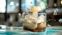 Explosive Splash of Iced Beverage in Glass