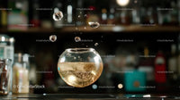 Floating Drink with Ice Cubes and Bubbles in Bar Setting