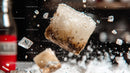 Floating Ice Cubes in Fizzy Beverage Splash