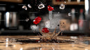 Dynamic Splash with Red Jewels and Ice Cubes
