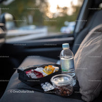 Travel Essentials with Snacks and First Aid Kit in Car