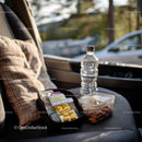 Travel Essentials with Snacks and First Aid Kit in Car