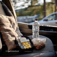 Travel Essentials with Snacks and First Aid Kit in Car