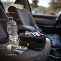 Travel Essentials with Snacks and First Aid Kit in Car