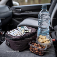 Travel Essentials with Snacks and First Aid Kit in Car