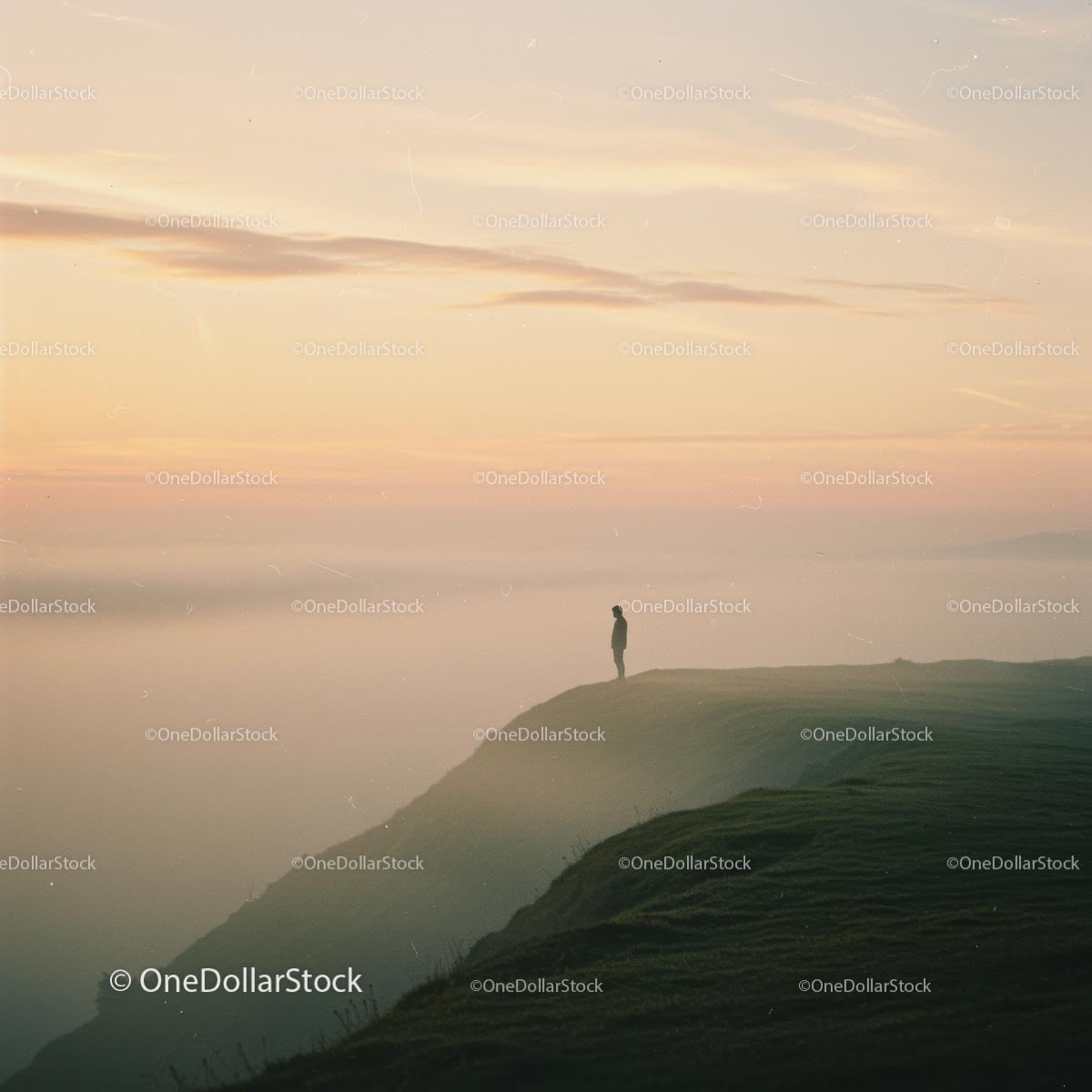 Silhouette on a Misty Cliff at Sunrise