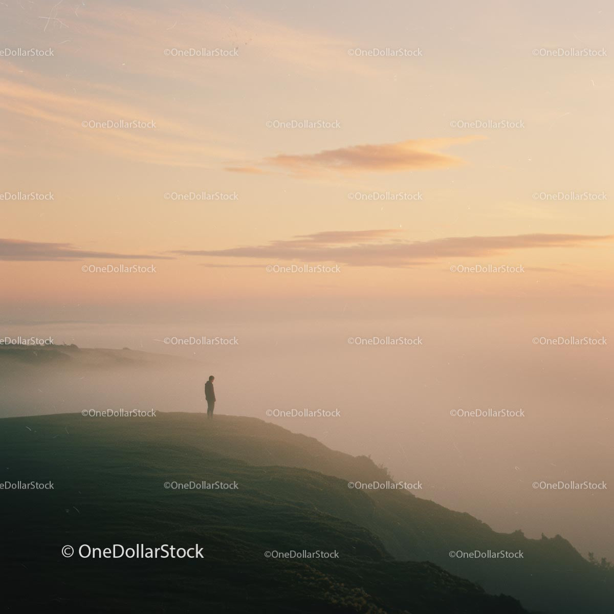 Person Standing on Foggy Cliff at Sunrise