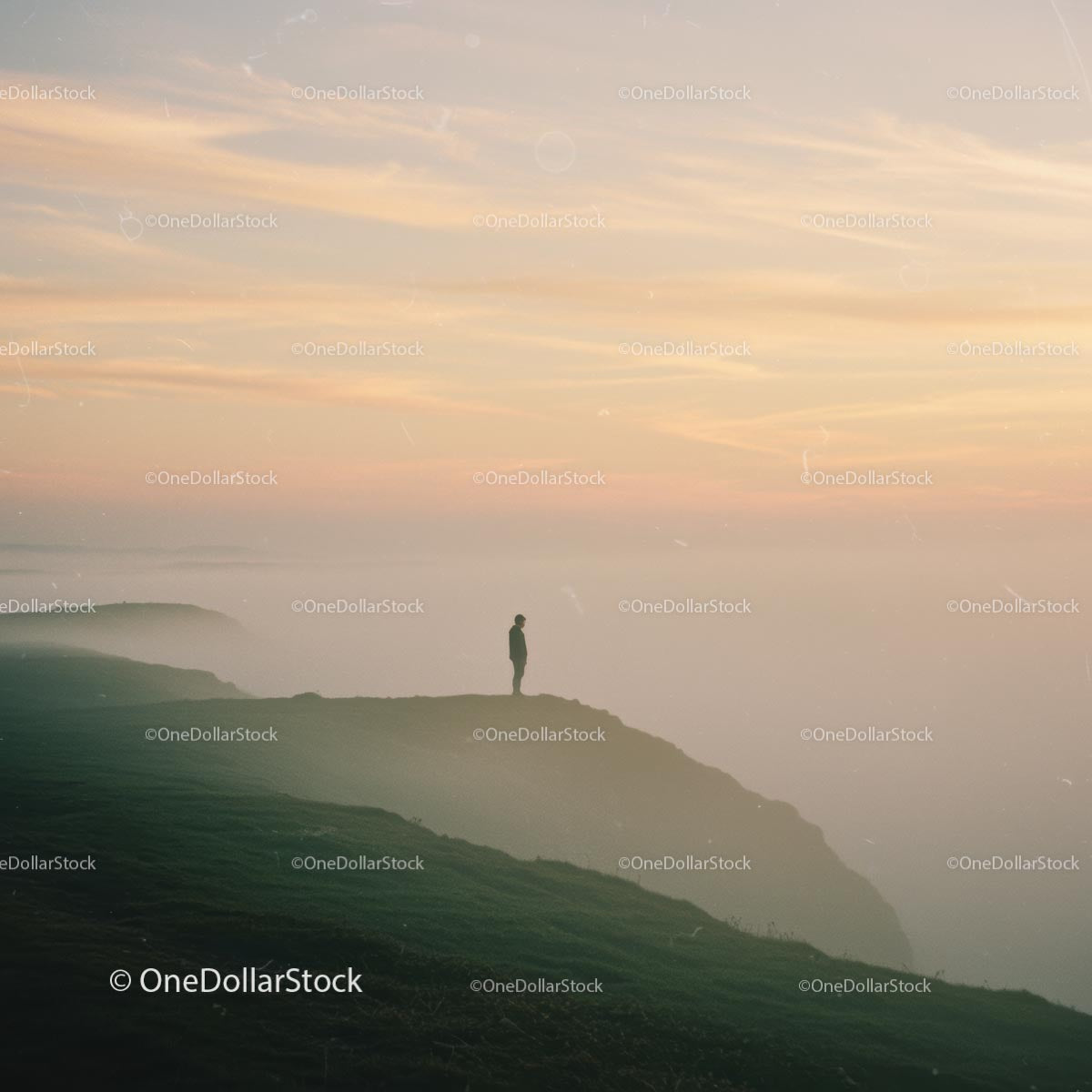 Solitary Figure on a Misty Cliff at Sunset