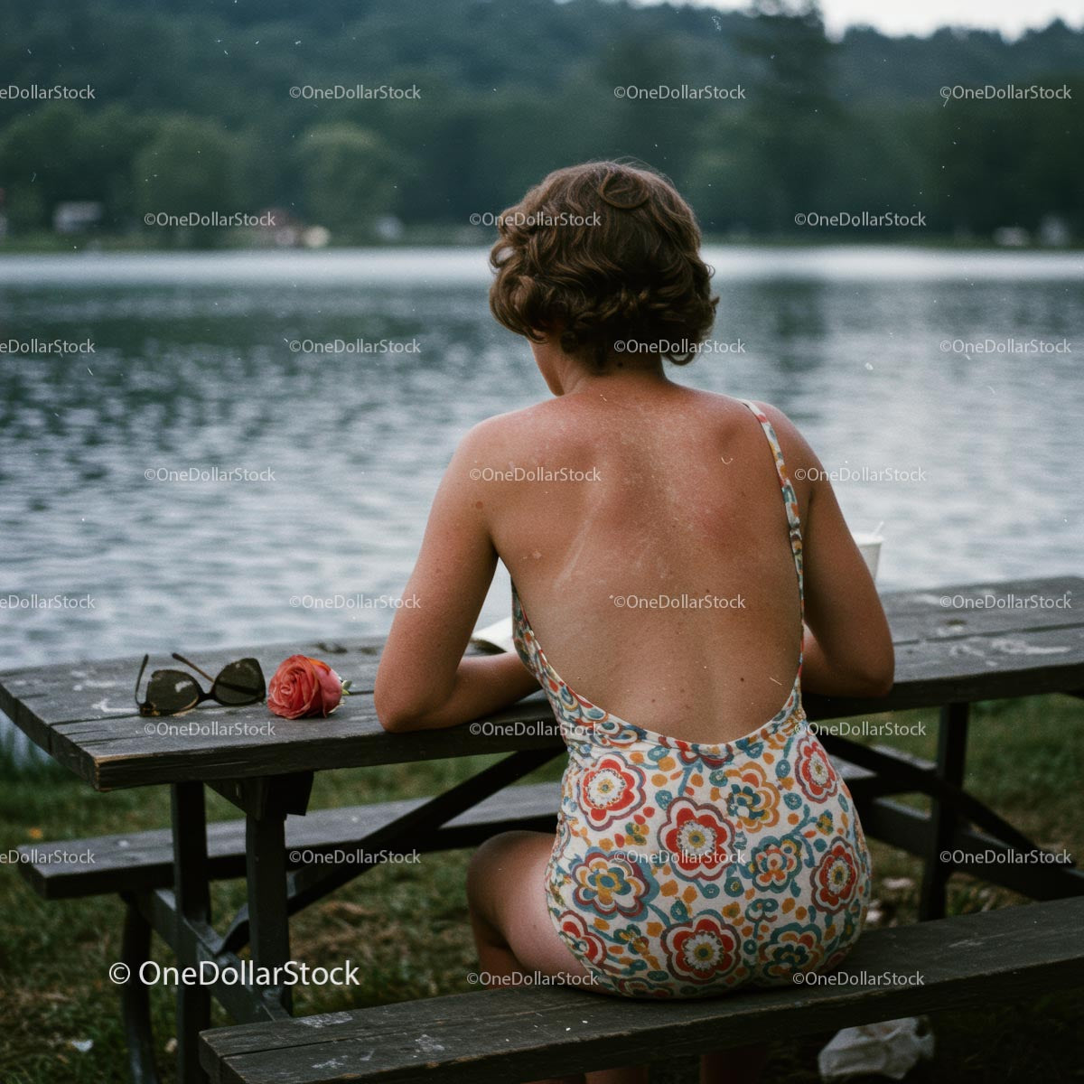 Woman in Floral Swimsuit Relaxing by the Lake