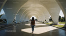 Person Walking Under Modern Concrete Arches