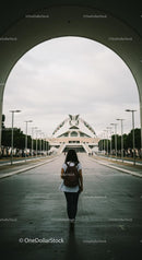 Woman Walking Towards Futuristic Architecture in Valencia
