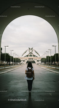 Woman Walking Towards Futuristic Architecture in Valencia