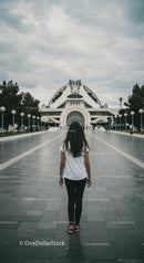 Girl Walking Towards Futuristic Building in Valencia