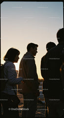 Silhouetted Group of People at Sunset