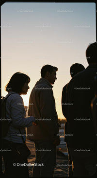 Silhouetted Group of People at Sunset