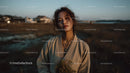 Pensive Woman Holding Yellow Wildflowers at Dusk