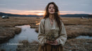 Pensive Woman Holding Yellow Wildflowers at Dusk