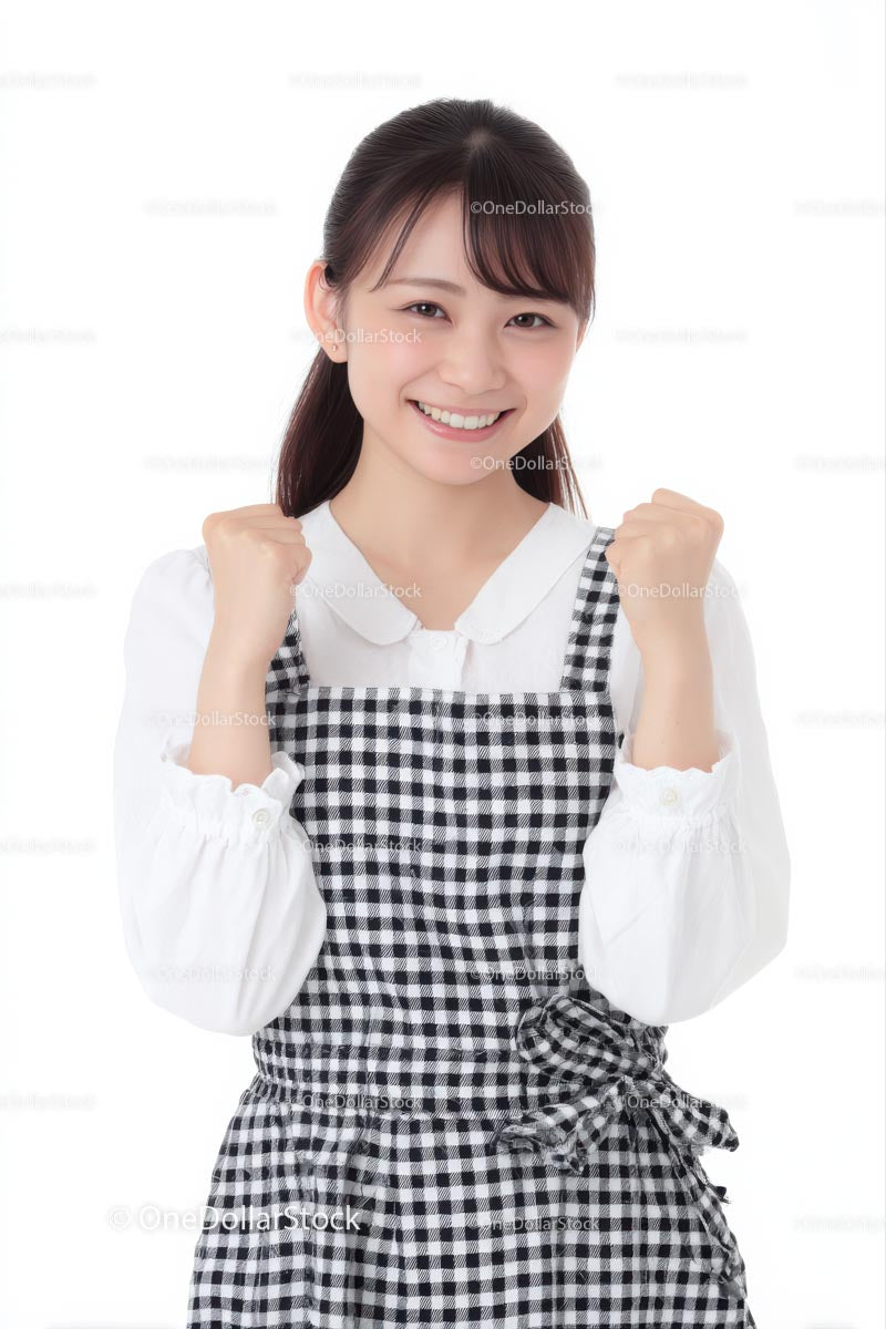 Smiling Woman in Black and White Plaid Dress