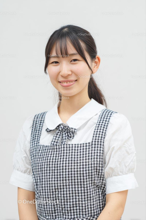 Smiling Woman in Gingham Dress with Friendly Expression
