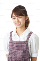 Smiling Woman in Casual Plaid Dress on Clean Background