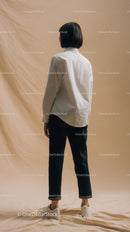 Minimalist Fashion with Woman in White Shirt and Black Pants