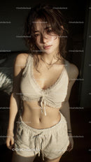 Woman in Cozy Loungewear Bathed in Warm Sunlight