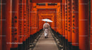 Traditional Pathway Through Vibrant Red Torii Gates in Kyoto
