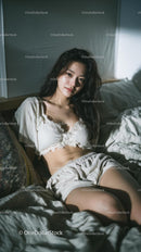 Woman Relaxing in Cozy Bedroom Setting with Natural Light