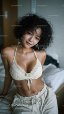 Smiling Woman with Curly Hair in Casual Cream Outfit