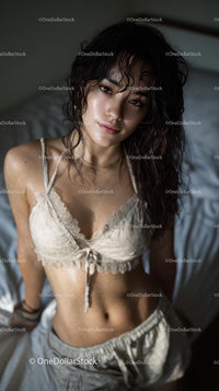 Woman Relaxing in Cozy Bedroom Setting with Natural Light