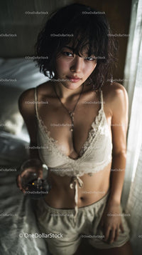 Young Woman Relaxing in Natural Light with Casual Attire