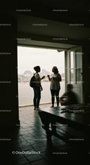 Casual Conversation by Open Balcony with City View