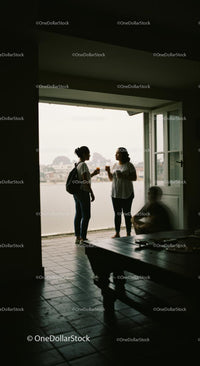 Casual Conversation by Open Balcony with City View