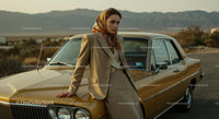 Stylish Woman in Beige Suit by Vintage Car and Desert