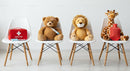 Stuffed Animals with First Aid Kit on Chairs