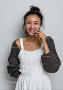 Smiling Woman in Stylish Knit Sweater with Braces