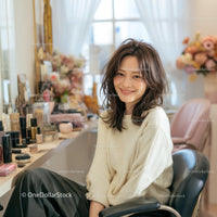 Smiling Woman in a Modern Beauty Salon