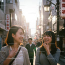 Two Friends Sharing a Laugh on a Sunny Urban Street