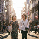 Joyful Couple Strolling Through a Sunlit Urban Street