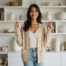 Smiling Woman in Cozy Beige Cardigan in Modern Living Room