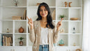 Smiling Woman in Casual Cardigan in Cozy Living Room